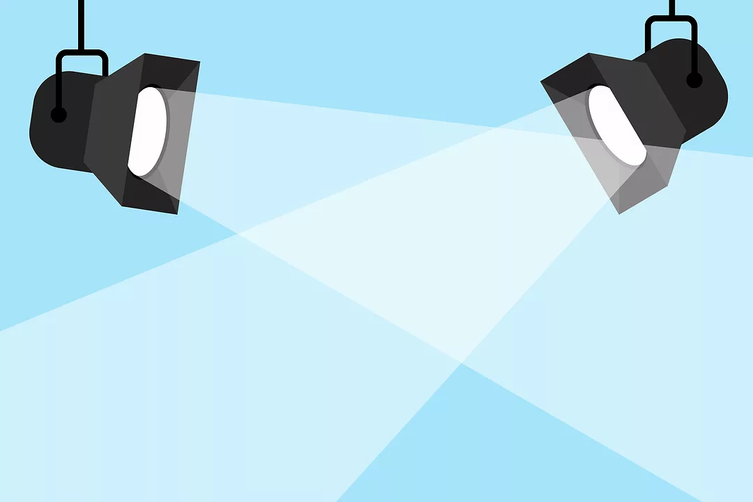 illustration of two crossed spotlights